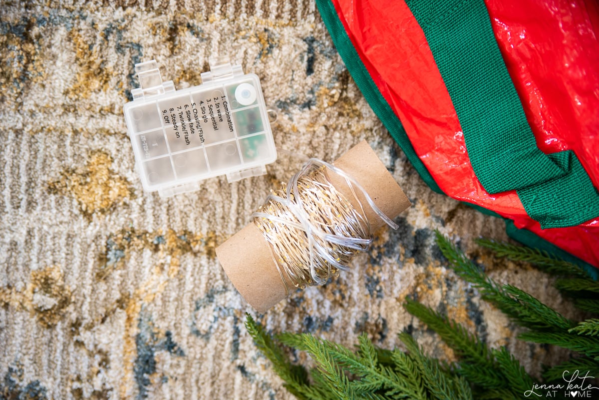 Mini fairy lights wrapped around a toilet paper roll