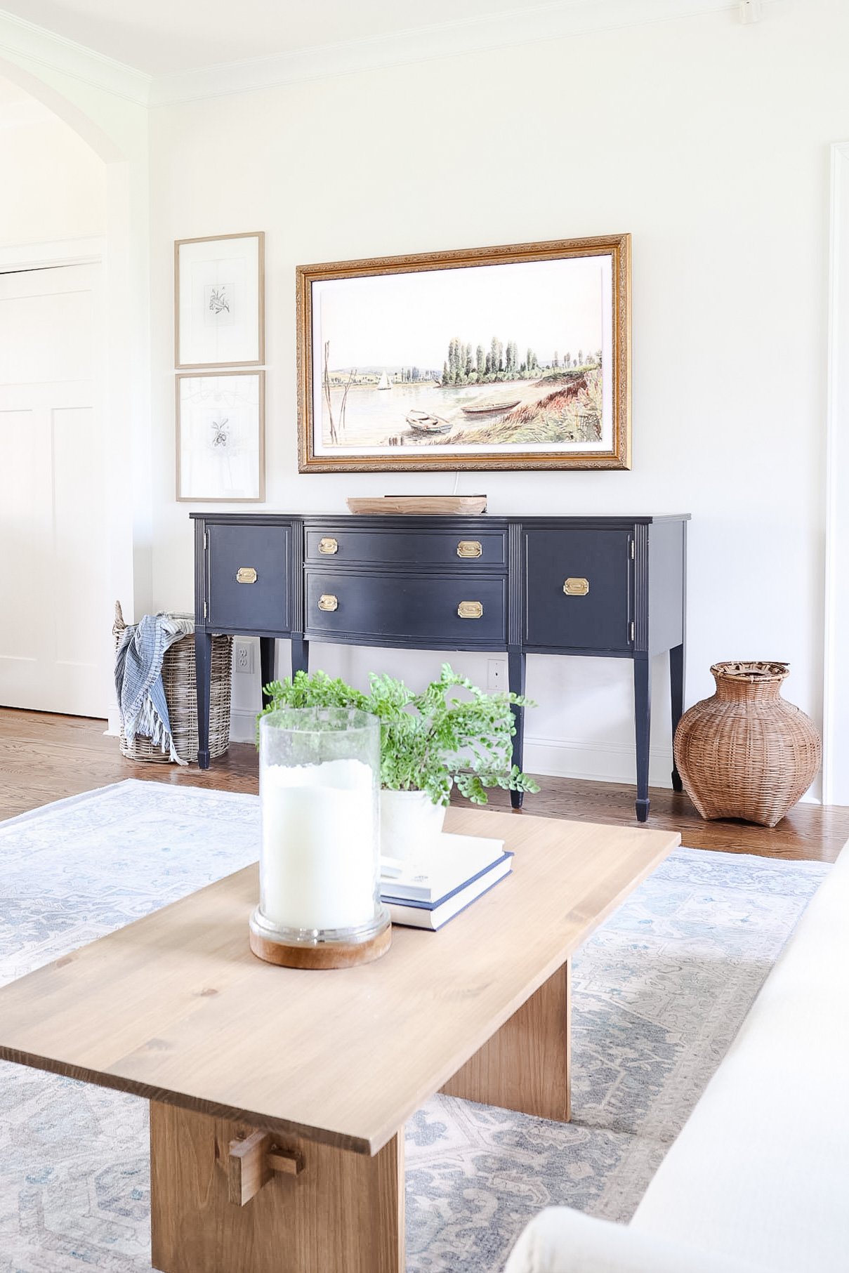 Bright living room with entry table painted in Benjamin Moore Onyx.