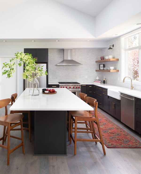 Bright white kitchen with cabinets and island painted with Black Magic by Sherwin Williams.