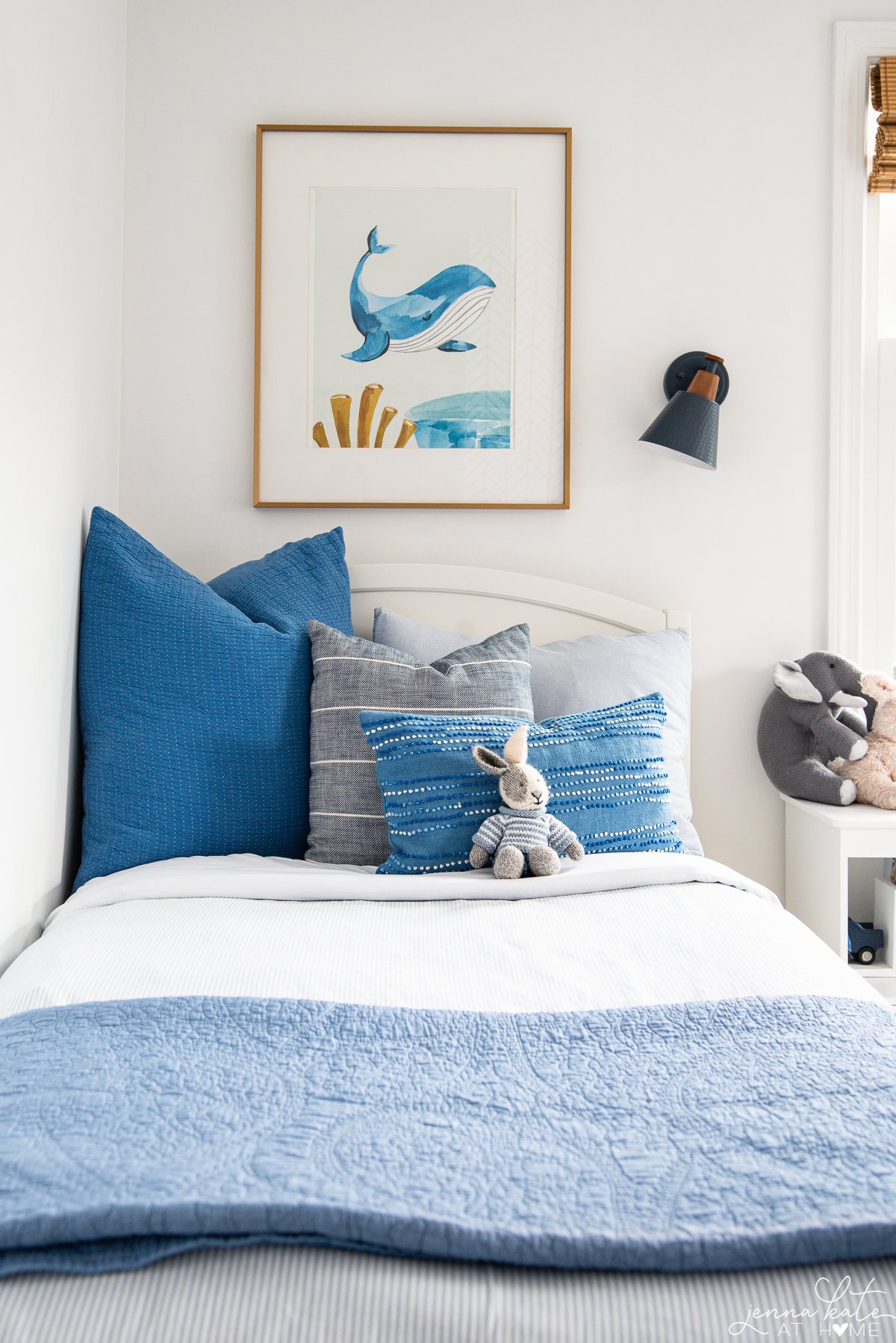 Pure white walls in a kids' room with blue accents.