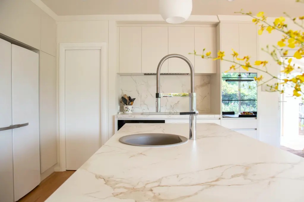 Creamy white kitchen with a beautiful marble countertop