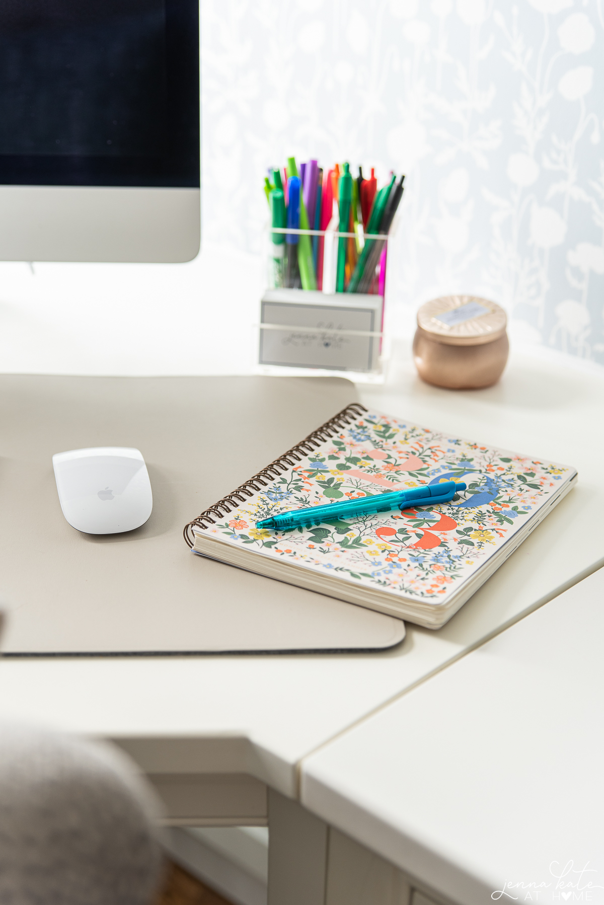 office desk with a notebook and pen