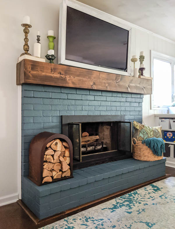 Brick fireplace painted teal.