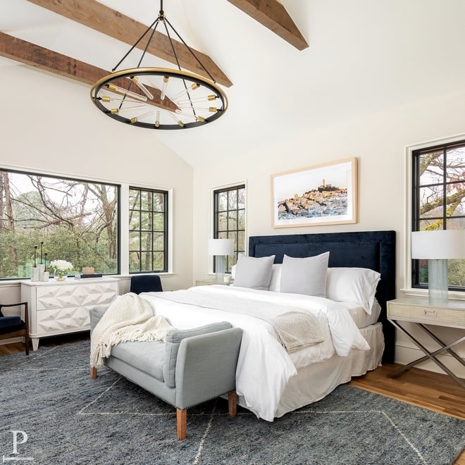 Large open bedroom with Benjamin Moore Ivory White walls. 