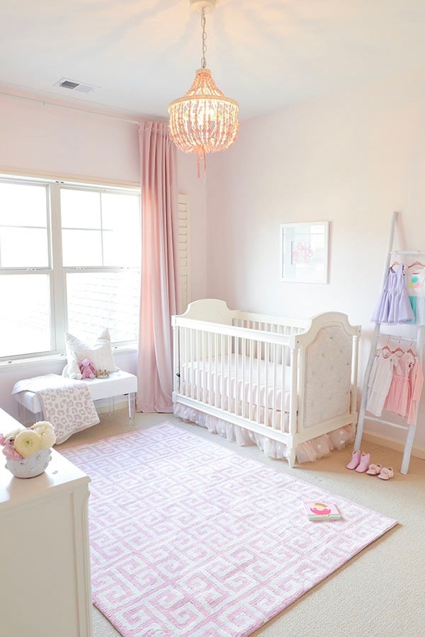Bright baby girl's nursery with Pink Bliss on the walls and pink accents throughout. 