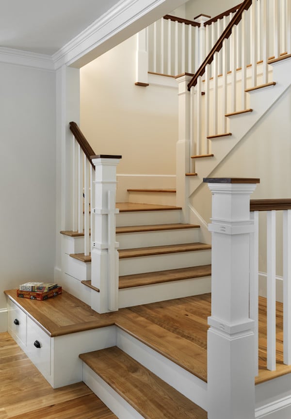 Staircase with wood floors and Sherwin Willams Creamy painted on the walls. 