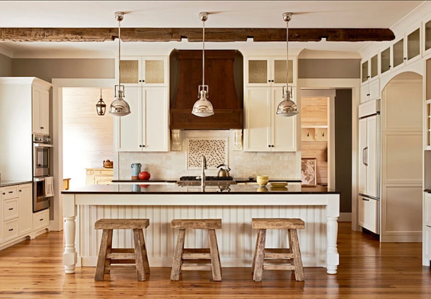 Warm farmhouse kitchen with Sherwin Williams Roman Column cabinets and trim. 