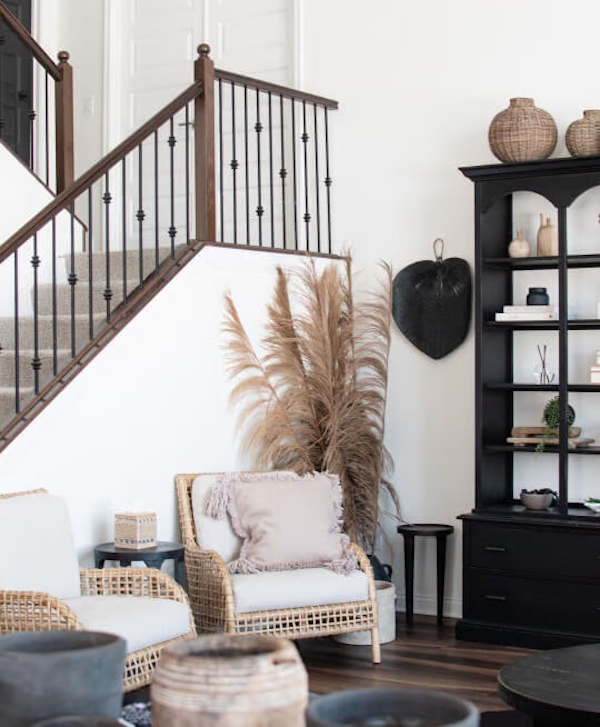 An airy and bright modern farmhouse living room with Sherwin Williams White Flour walls. 