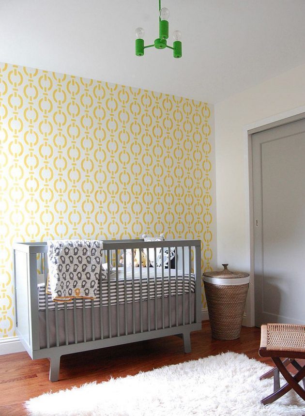 Bright nursery with yellow and white pattern focal wall. 