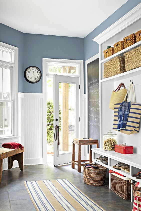 mudroom walls painted Sherwin Williams Bracing Blue with crisp white wainscoting