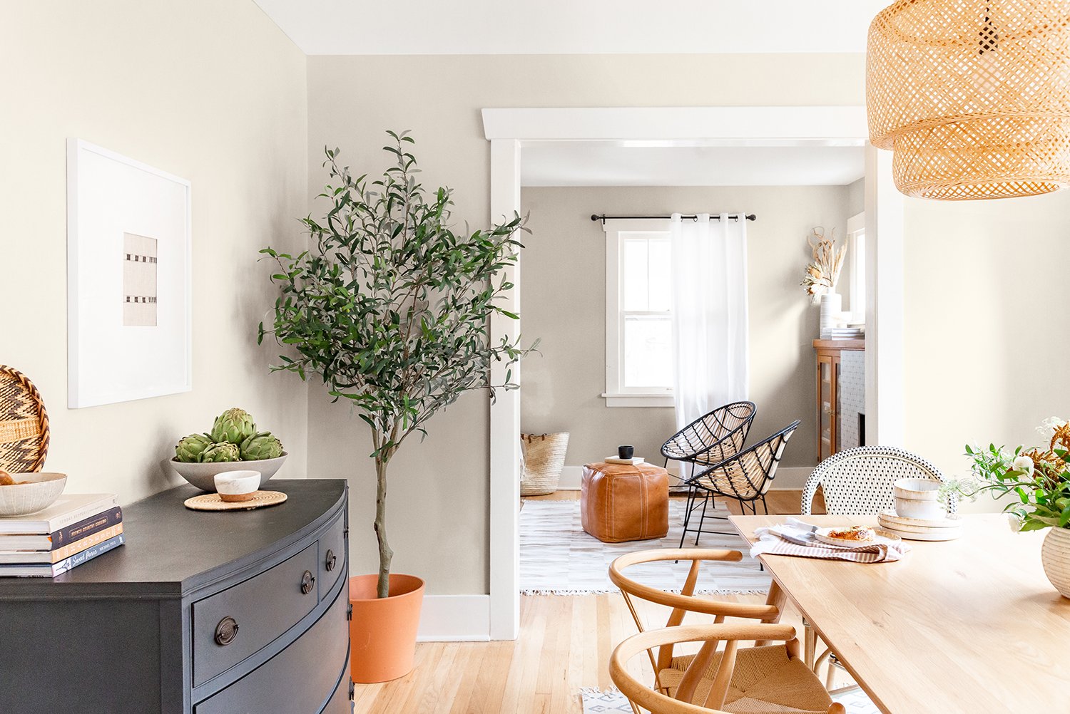 bm pale oak dining room with tree in the corner and wood furniture