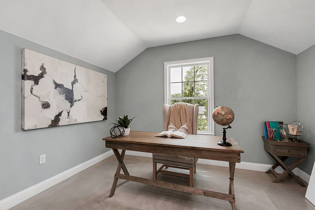 A home office with wall colors painted in sherwin williams misty