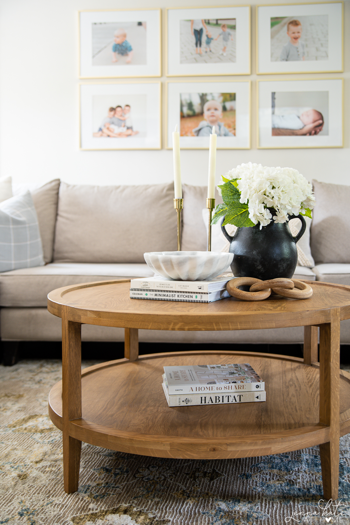 hydrangeas in a black vase on a coffee table