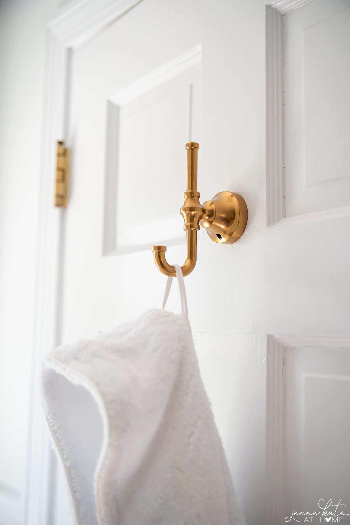 Brass robe hook on the back of a door