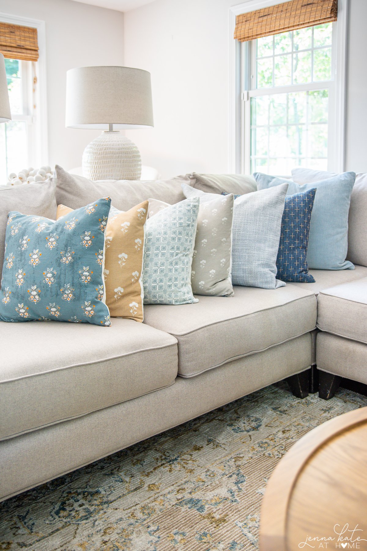 seven different Amazon throw pillows on a couch