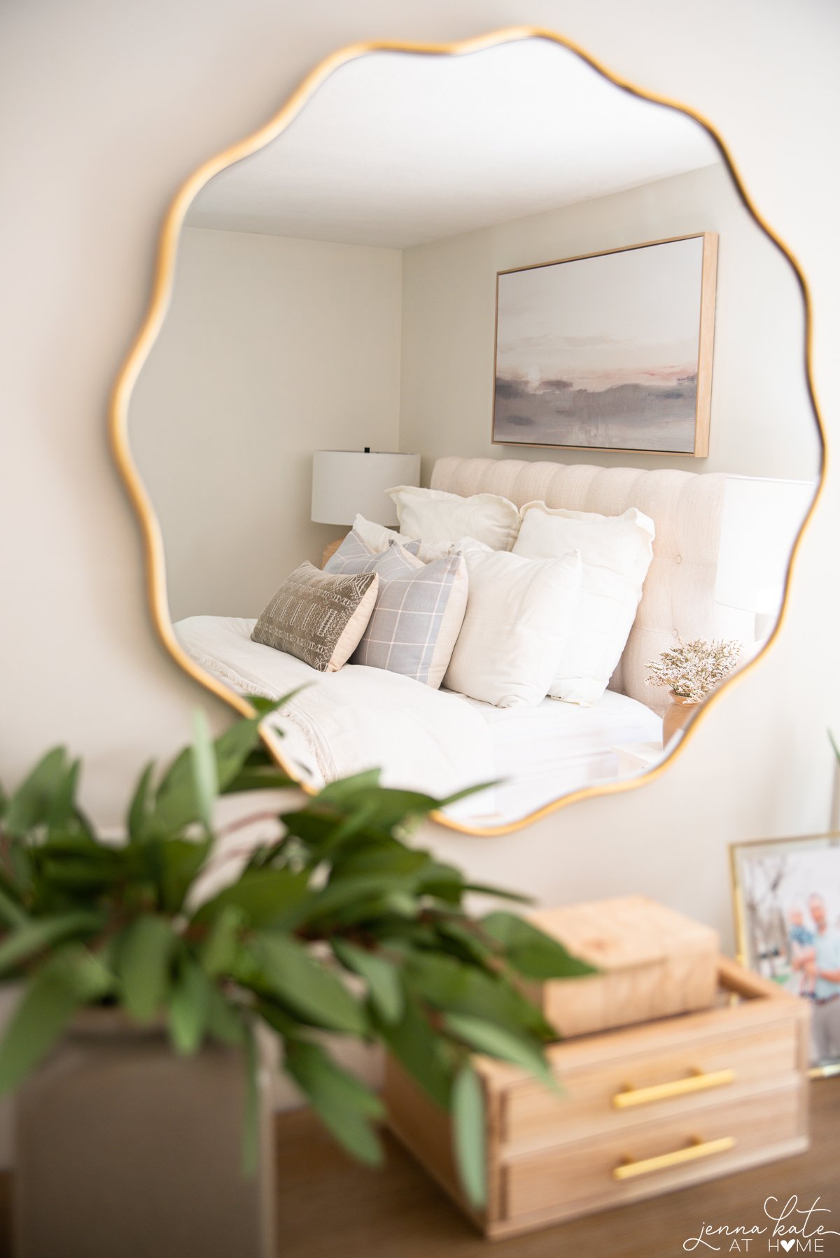 reflection of the bed in the brass mirror