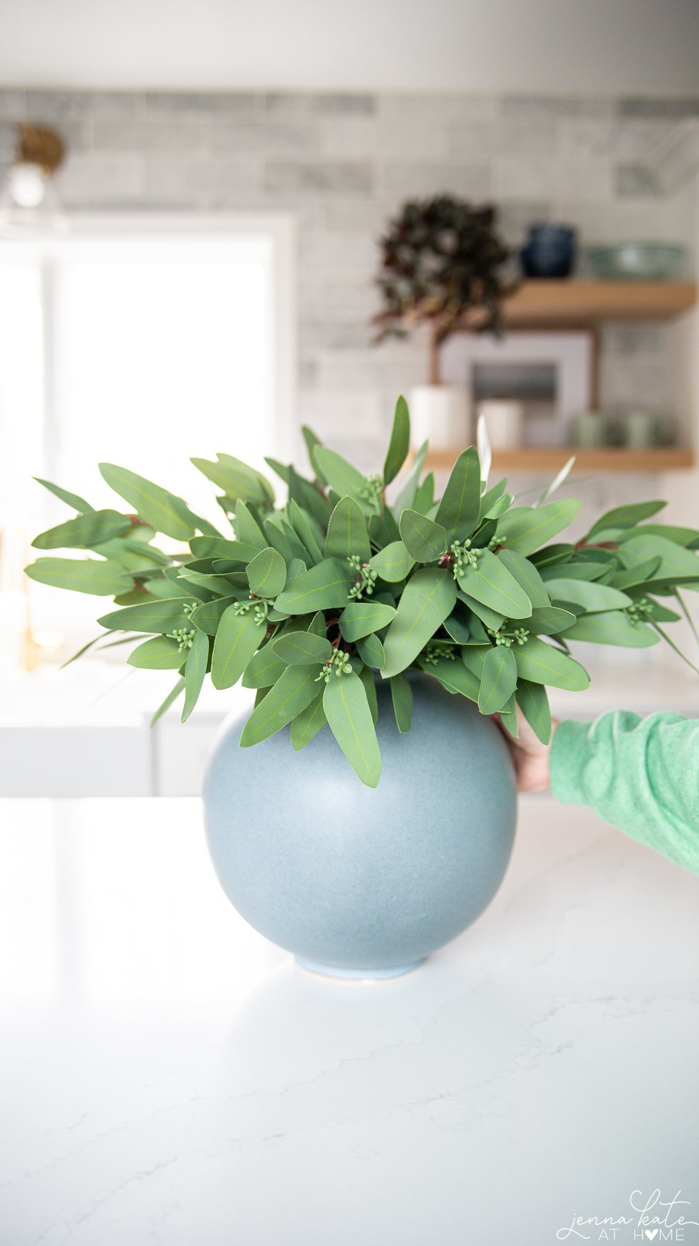 Amazon faux eucalyptus stems in a large round vase