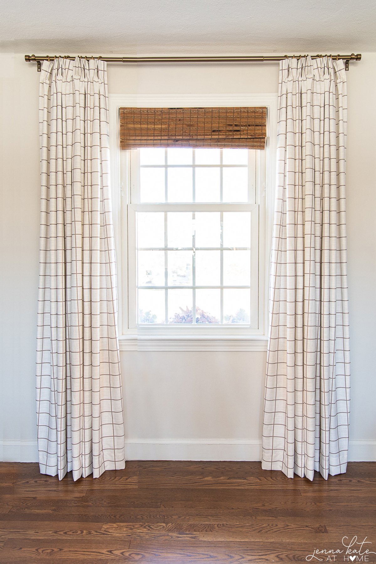 Beige and white window pane patterned curtains