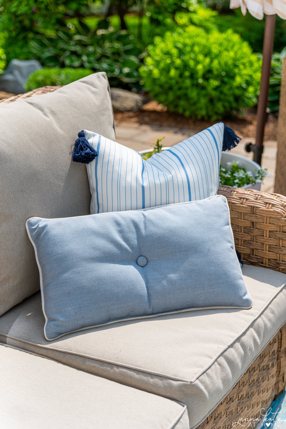 outdoor sofa with a two blue outdoor pillows