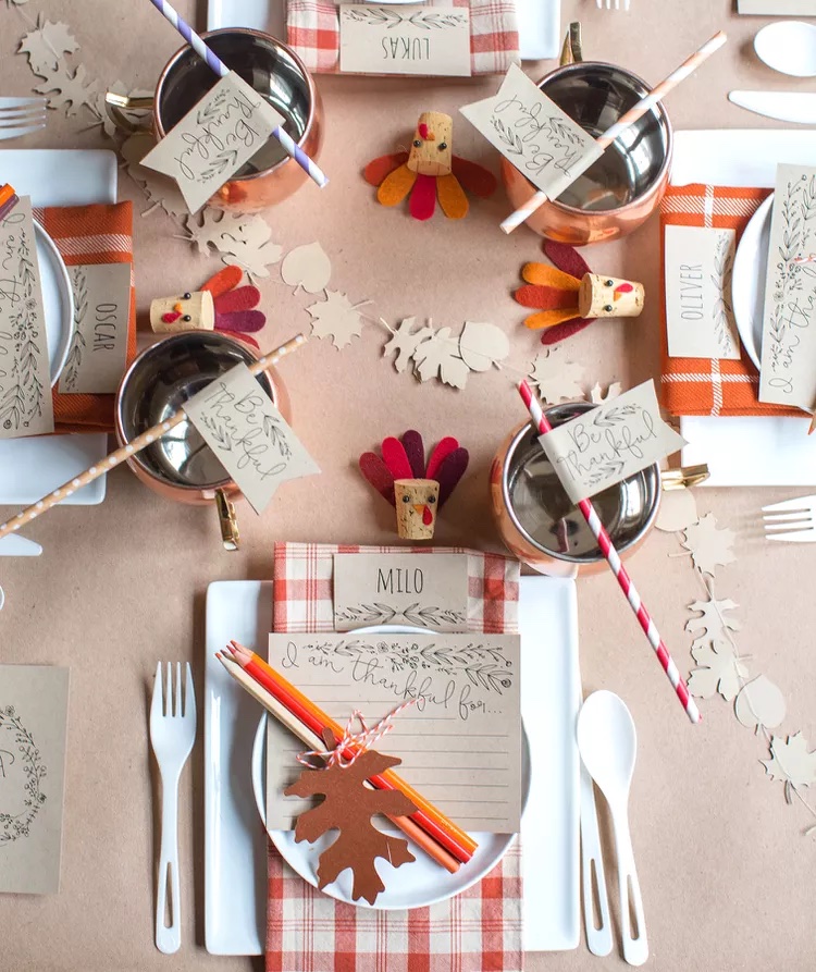 Kids Thanksgiving table with colored pencils, straws, and cork turkeys