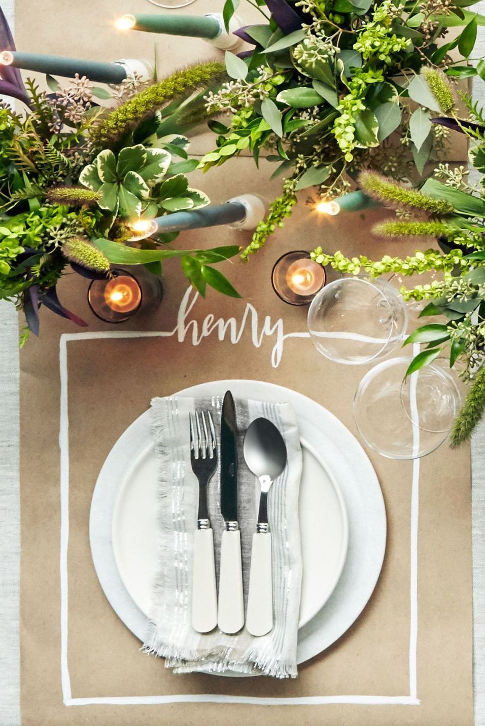 Kraft paper table runner with guests' names written in white marker