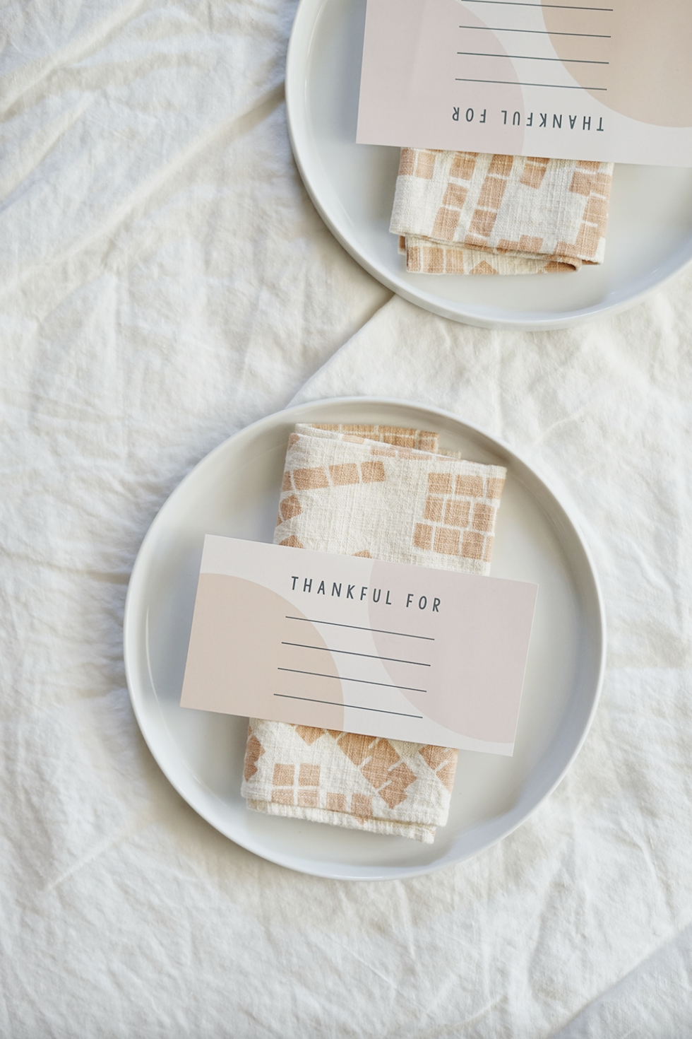 Neutral and modern place card with Thankful For written on it and room to write on 