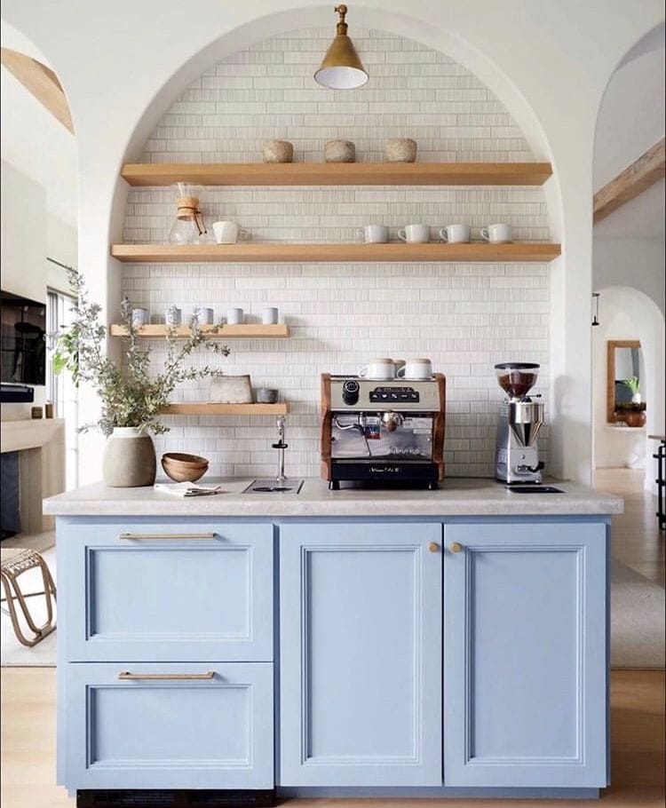 Beautiful modern coffee bar nook with light blue cabinet and wood shelves