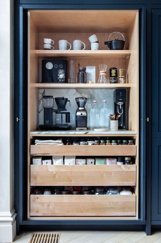 Coffee bar cabinet stocked with all essentials to make coffee