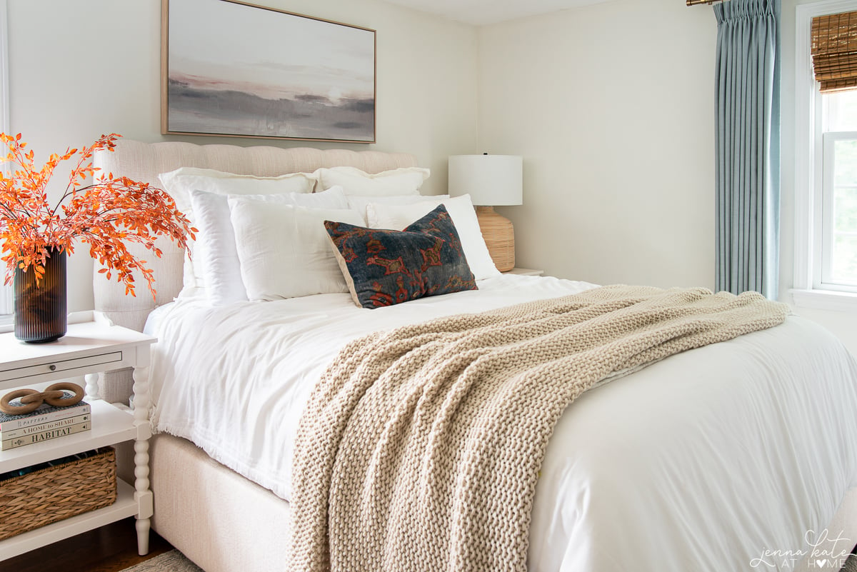 bedroom with pops of rust and blue for fall.