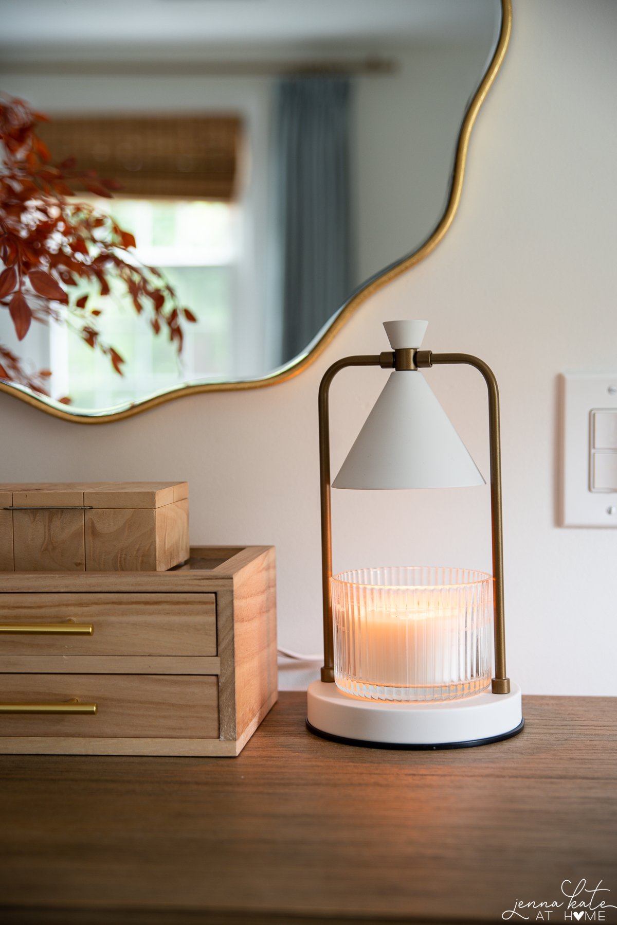 candle warmer displayed in bedroom on dresser.