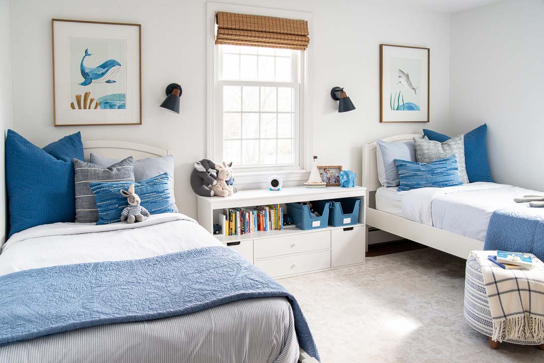 southern exposure kids bedroom with white walls and blue accents