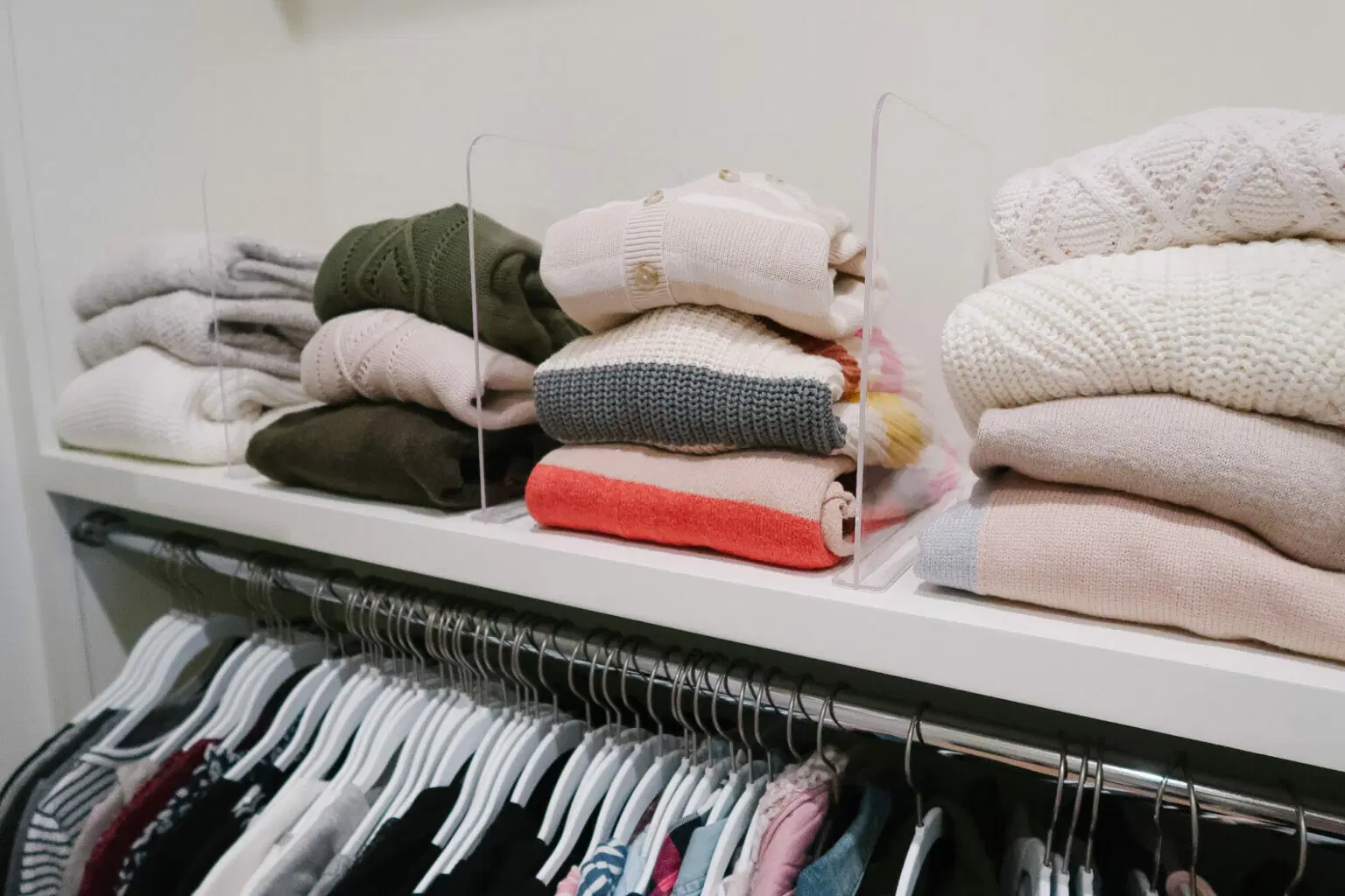 Acrylic Dividers sorting sweaters in a closet.