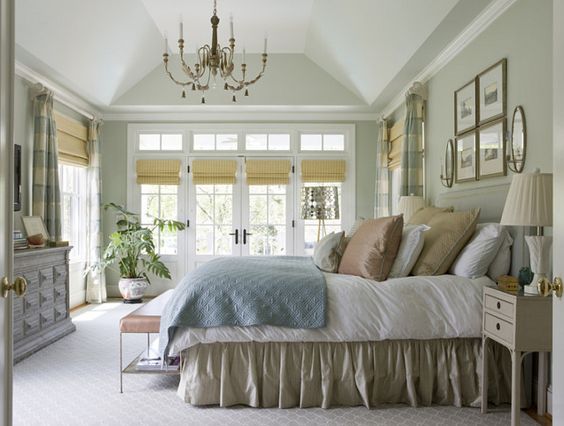 Bedroom walls painted soft sage green.