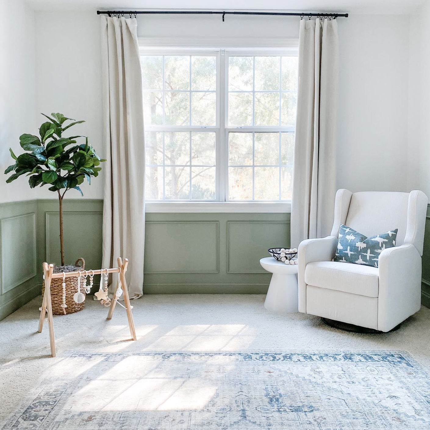 nursery with sage green wainscoting.