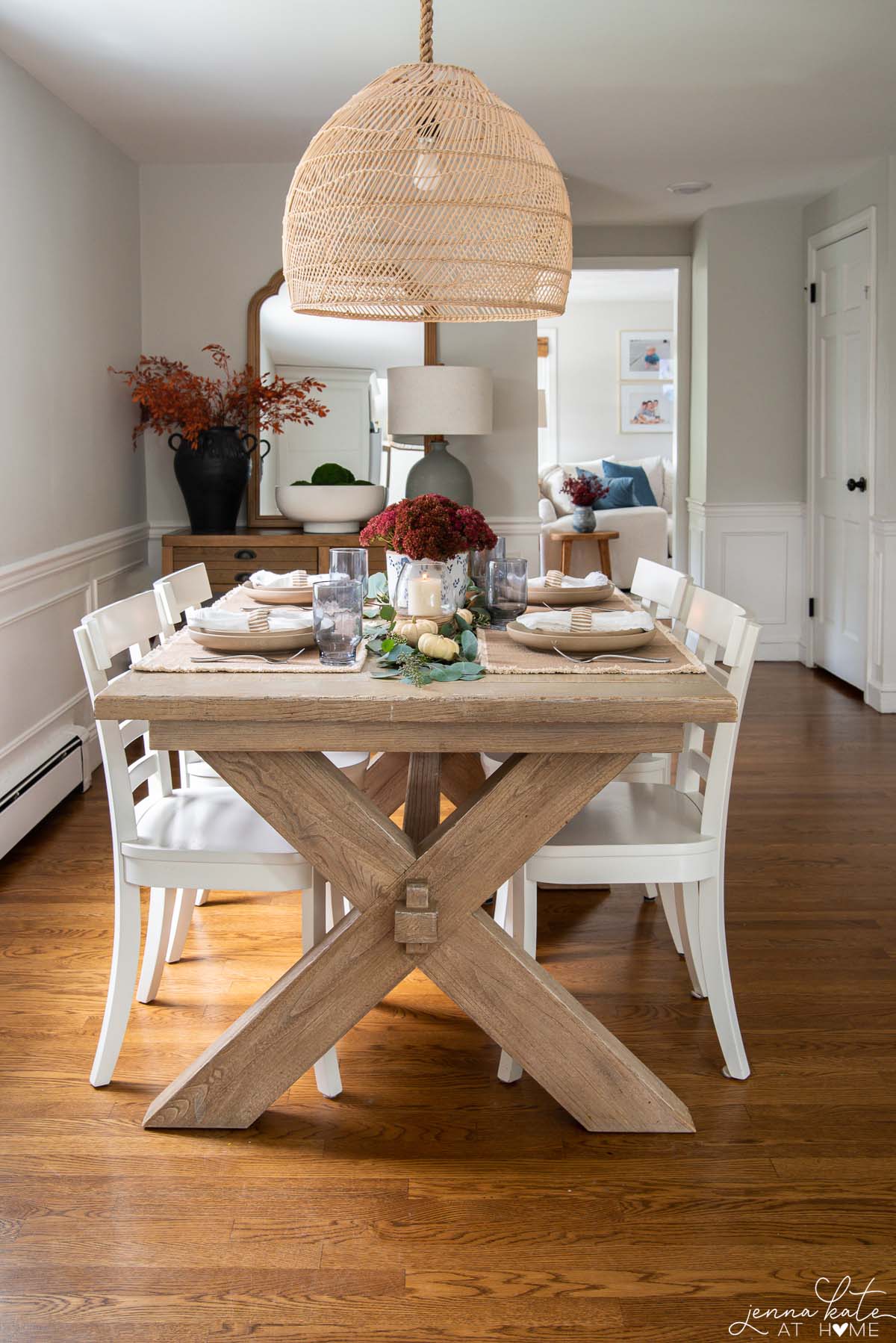 dining table with rattan pendant and fall themed table setting