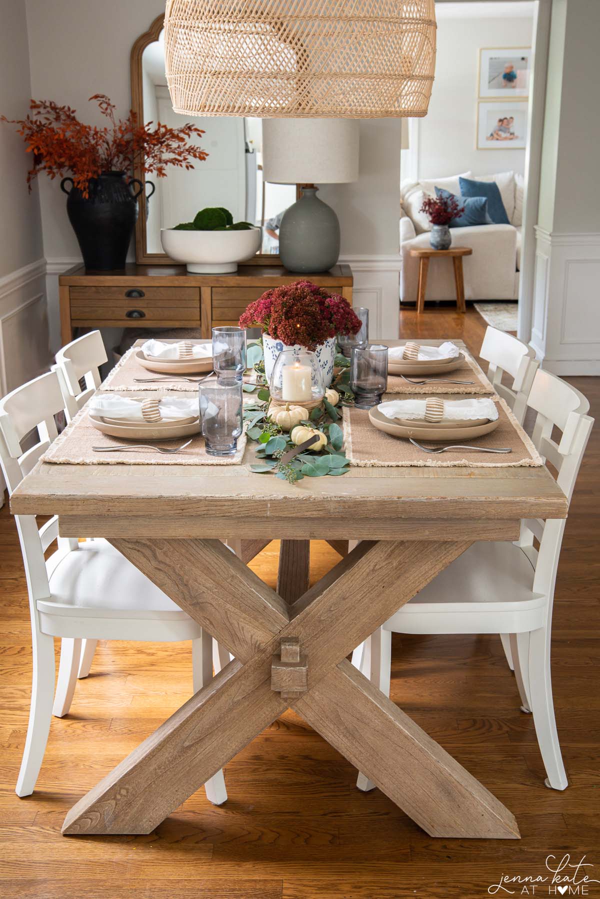 view of the fall tablescape and dining table looking into the living room