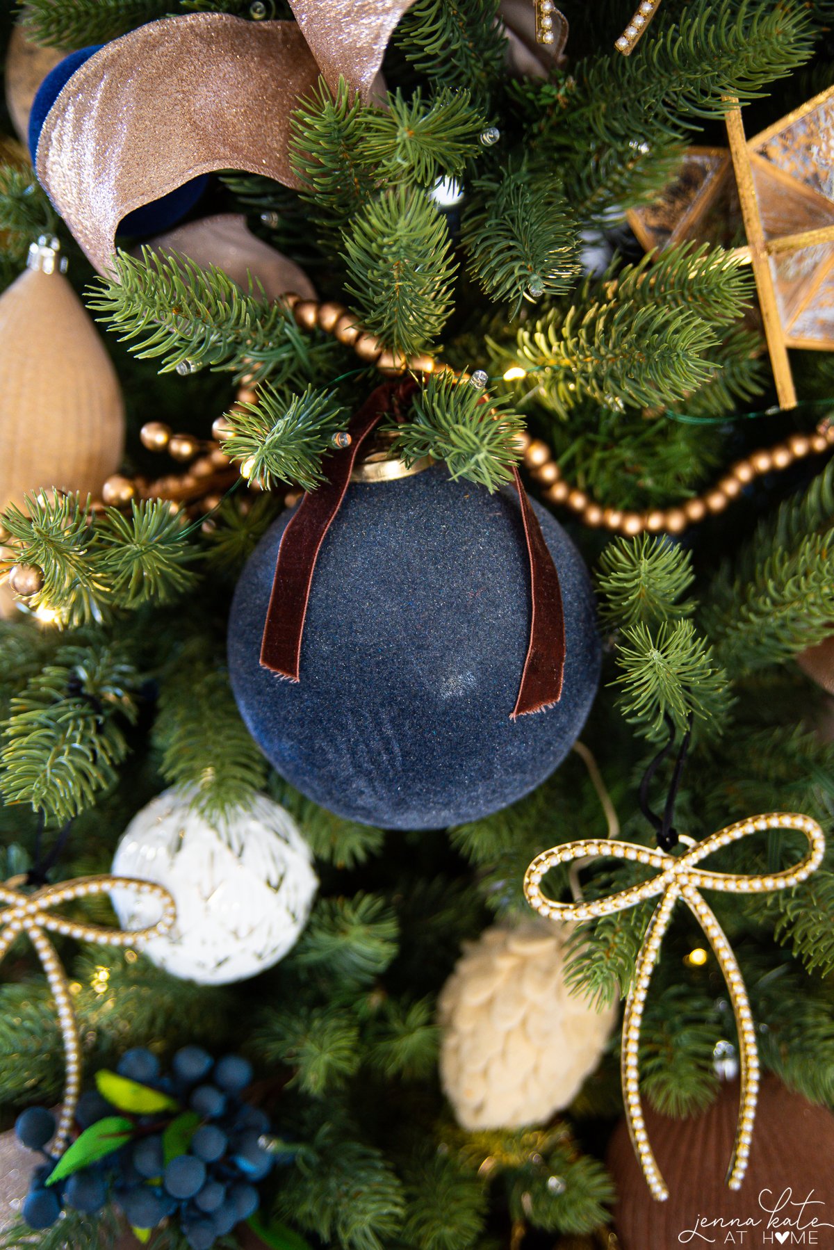 large blue flocked ball ornaments with ribbon