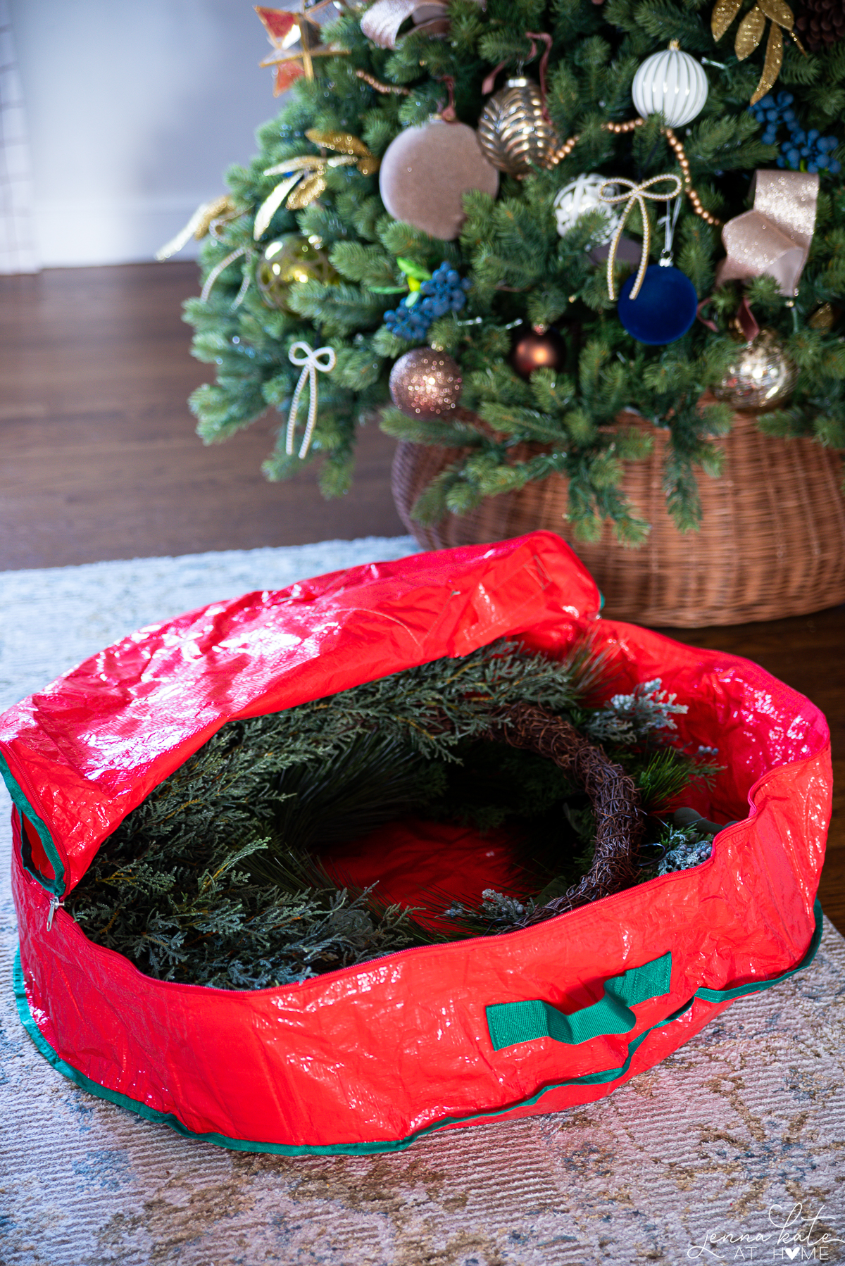 red wreath storage bag with two wreaths inside.