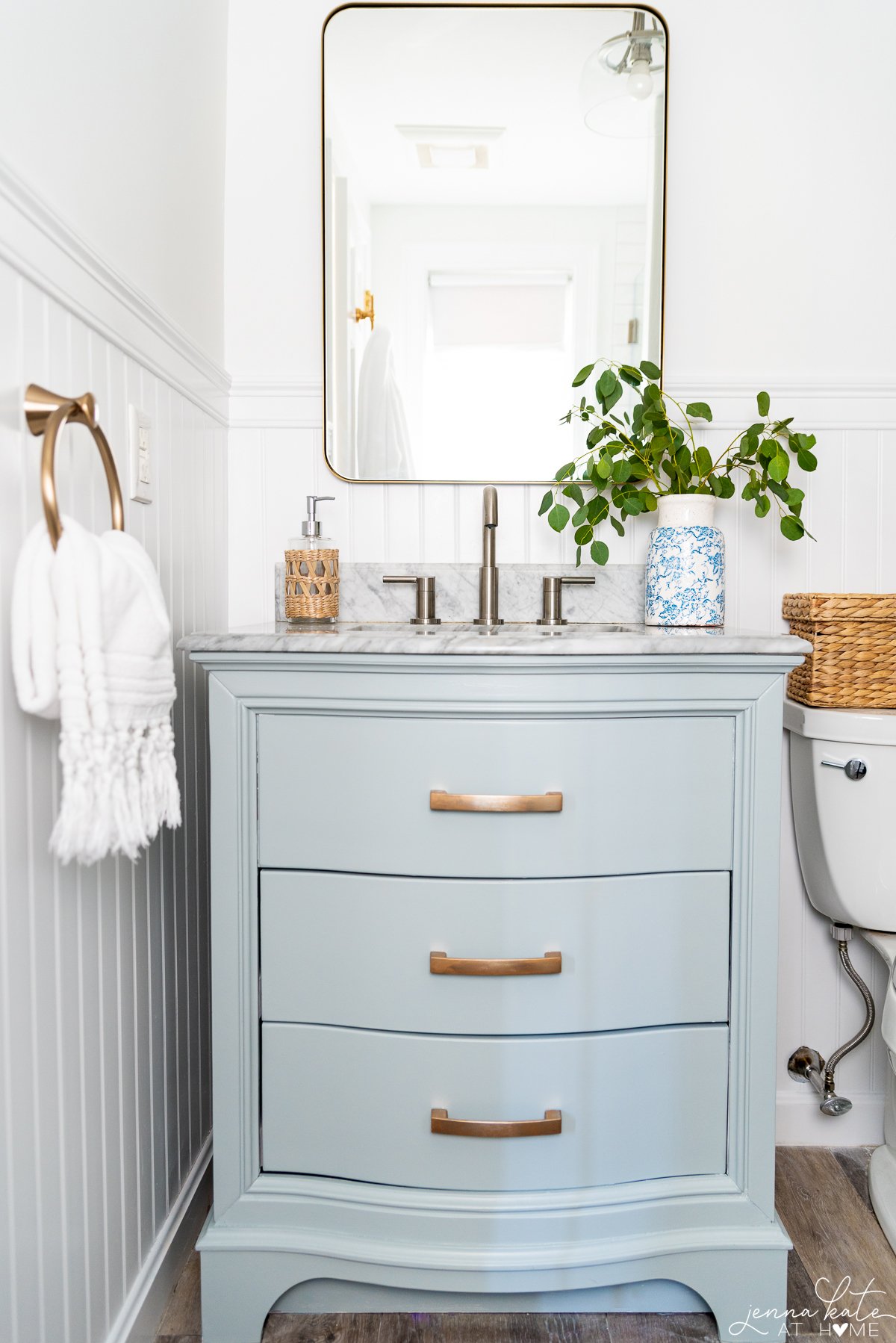 Small bathroom with a vanity painted Benjamin Moore Boothbay Gray.