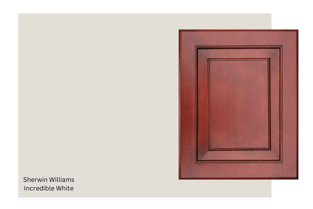 cherry wood cabinet with a swatch of Sherwin Williams Incredible White.
