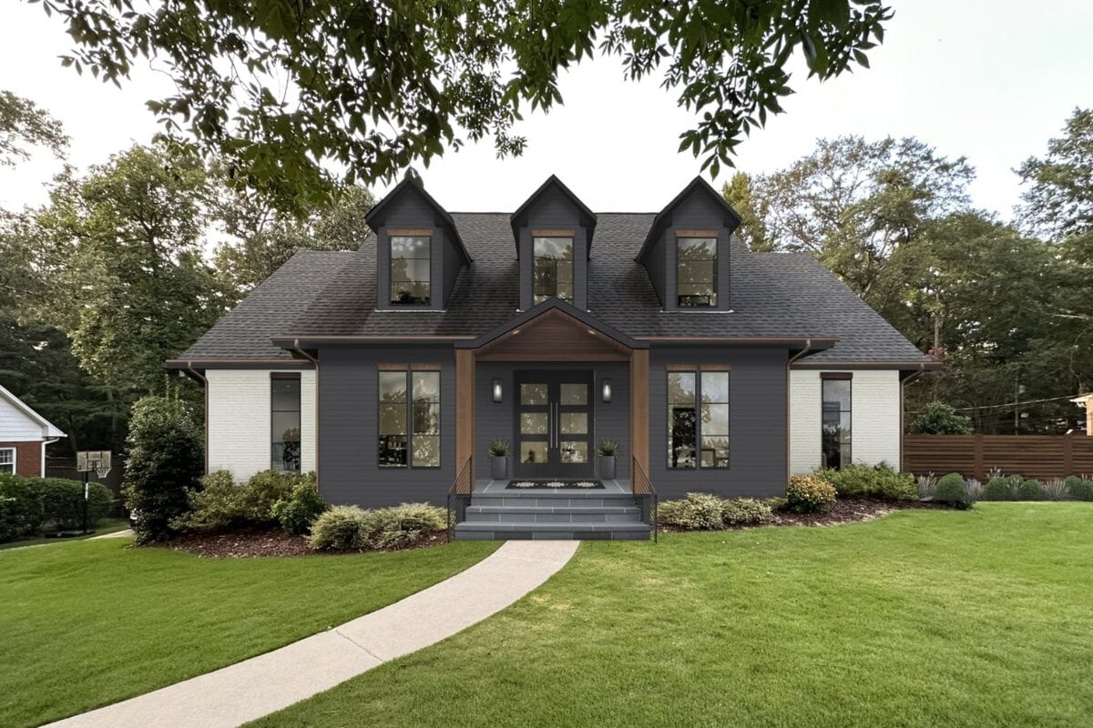A beautiful exterior photograph of a home painted with Wrought Iron with white sides and brown beams. The windows are also black providing a consistent and modern look.