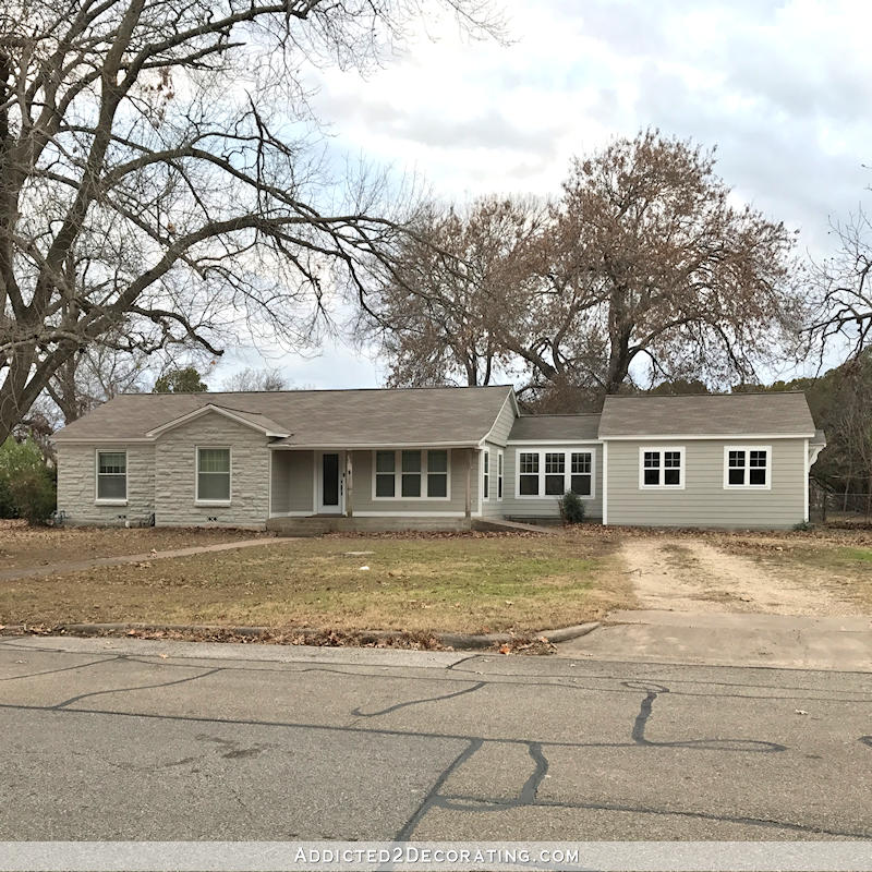 small ranch house exterior painted Sherwin Williams Mindful Gray.