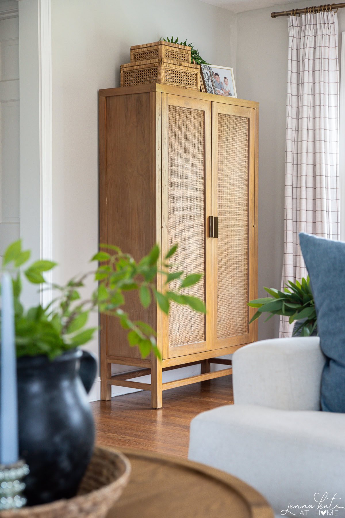 tall storage cabinet in the corner of the living room.