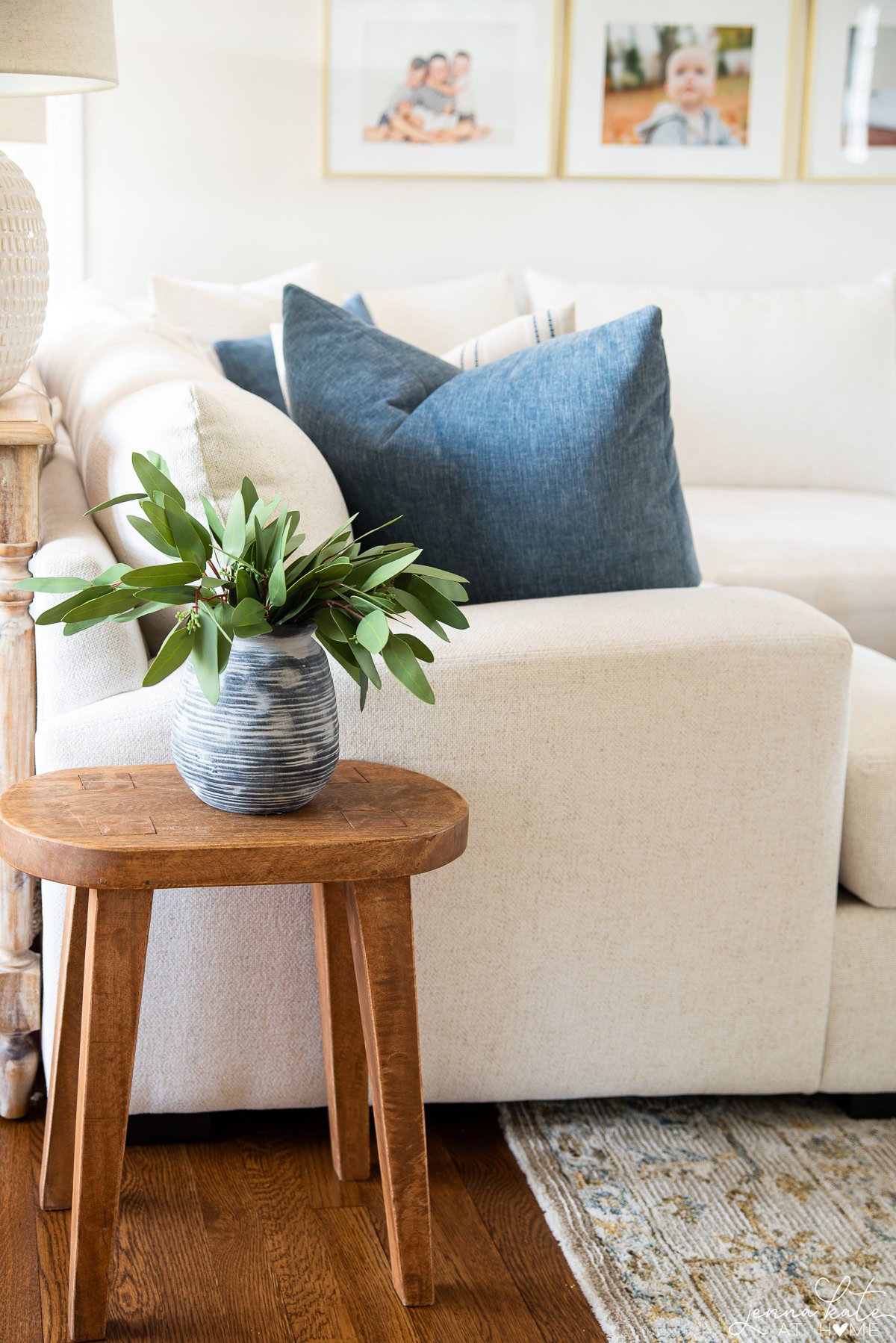small accent table next to a white couch.