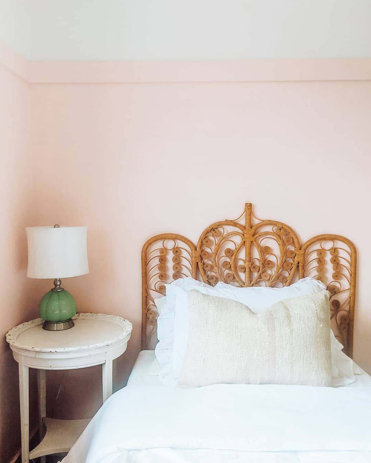 small bedroom with walls painted Sherwin Williams Blushing.