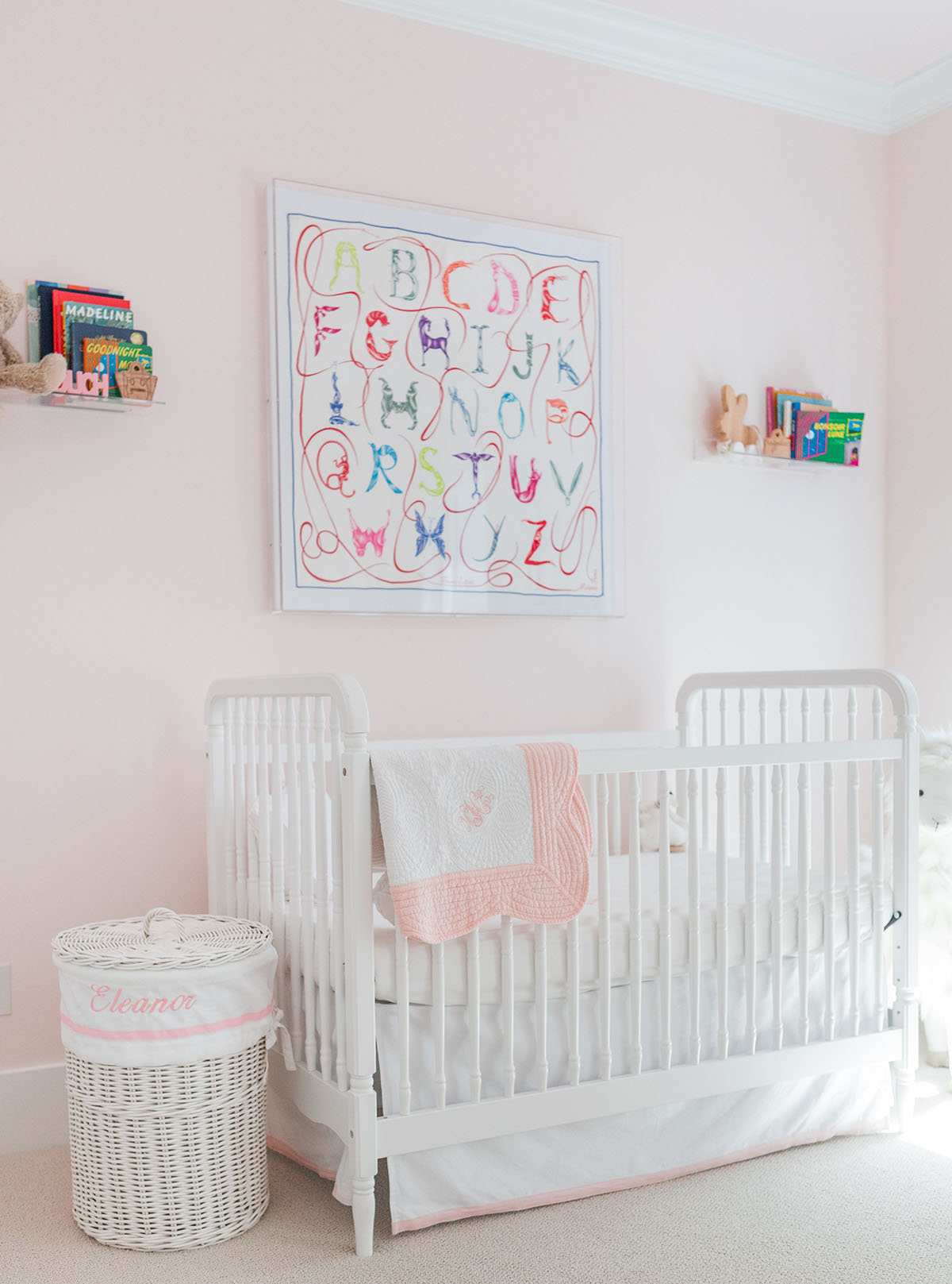 nursery with benjamin Mooore Gentle Butterfly walls and a white crib.