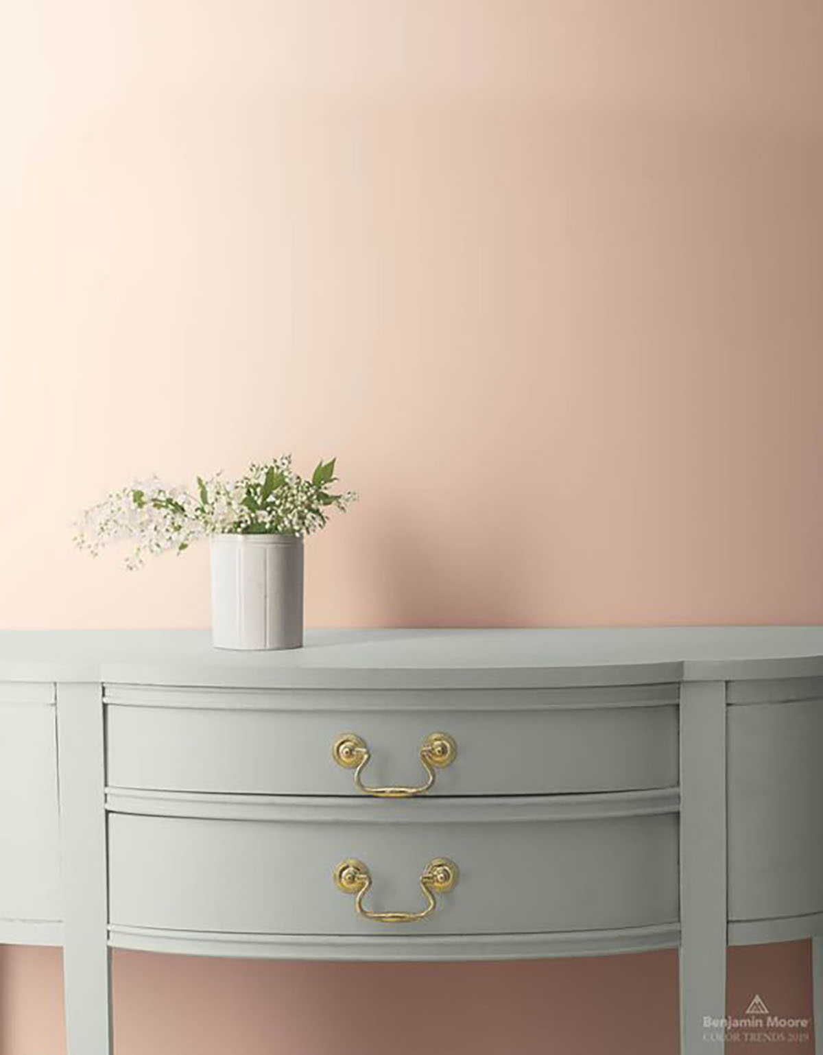 Plain wall painted BM Head Over Heels with a console table in front of it.