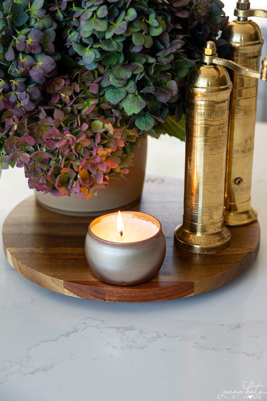 small lit candle on a kitchen island.