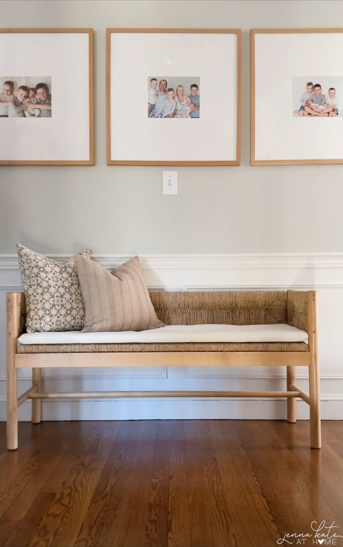 large artwork over board and batten in a hallway, with a bench beneath.