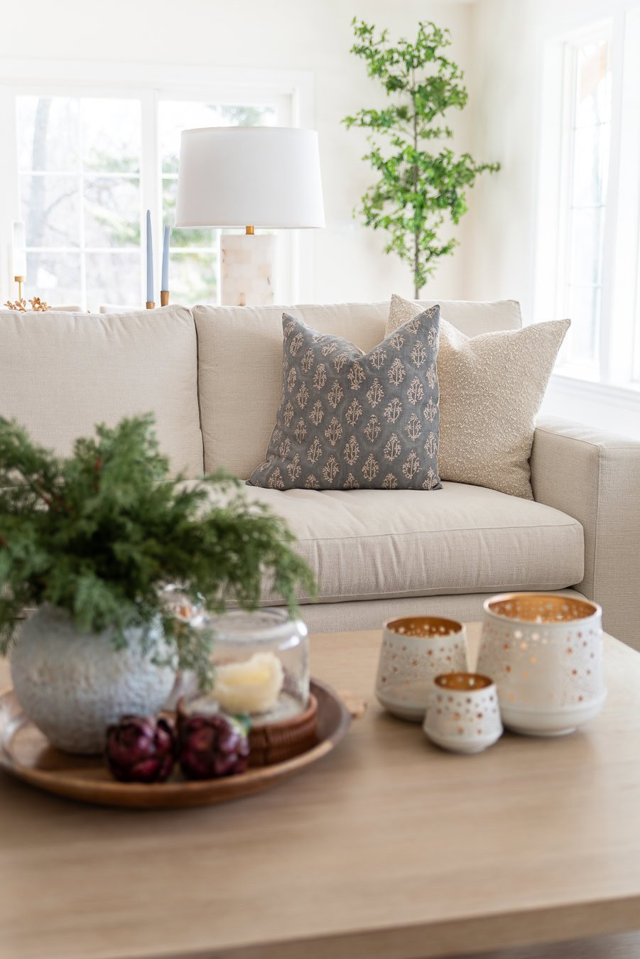 Showing the neutral color scheme with soft pops of blue in the pillows.